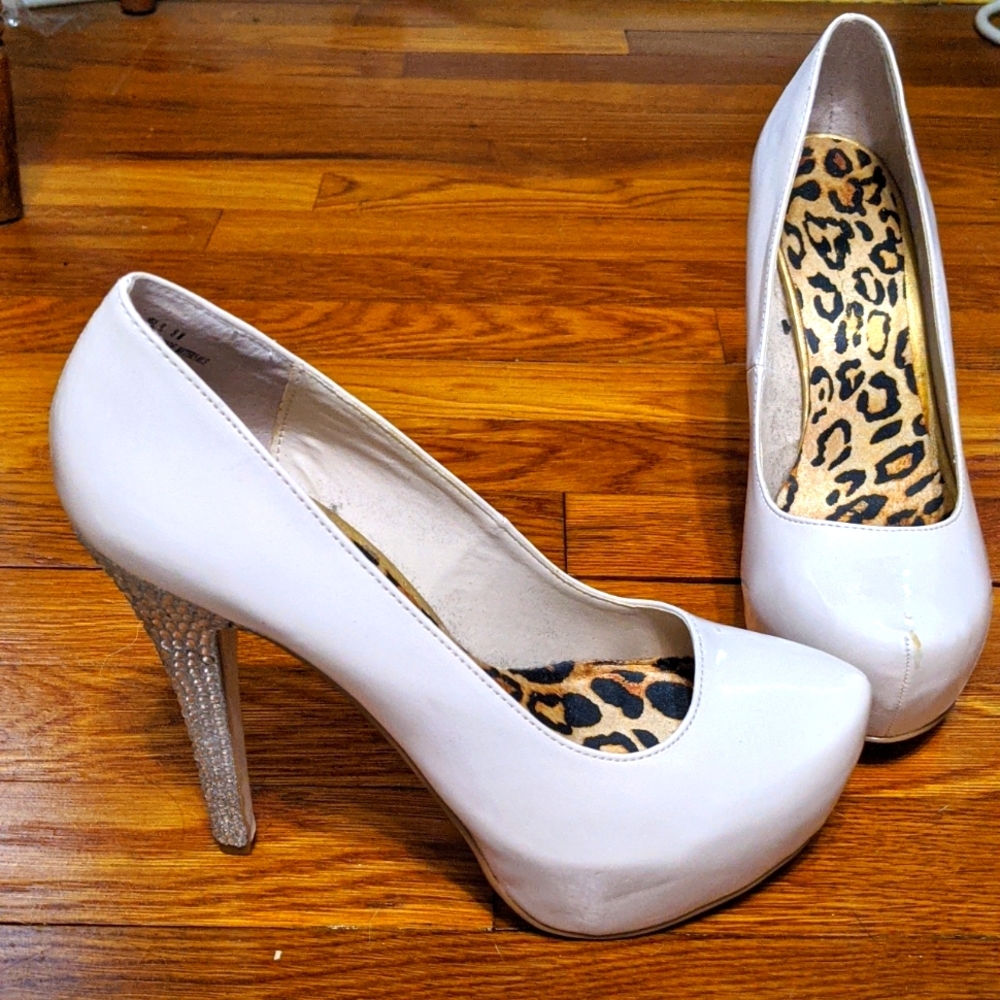 Nude patent leather pumps with rhinestone heels